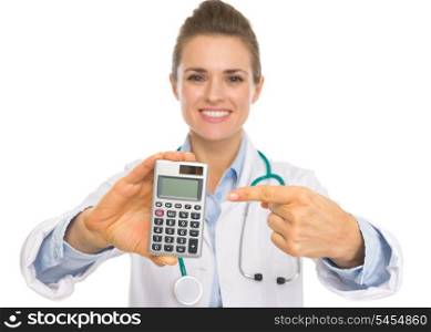 Closeup on doctor woman pointing on calculator