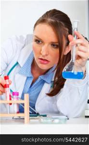 Closeup on doctor woman working with test tube in laboratory&#xA;