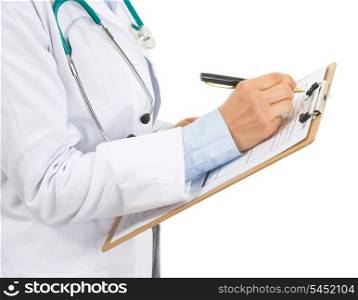 Closeup on doctor woman writing in clipboard