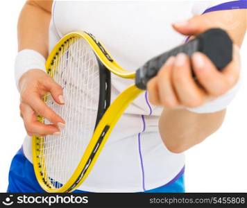 Closeup on female tennis player playing on racket as on guitar