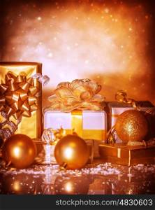 Closeup on festive golden Christmastime still life, many different gift boxes, happy holiday, Christmas ornament, winter time season