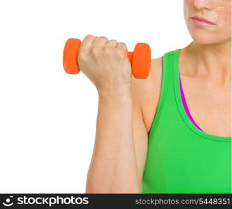 Closeup on fitness woman making exercise with dumbbells