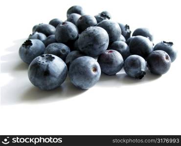 Closeup on fresh blueberries isolated on white background