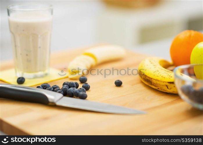 Closeup on fruits and fresh cocktail on cutting board