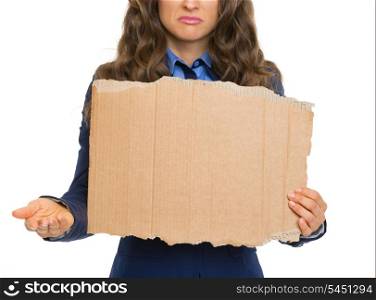 Closeup on frustrated business woman showing blank cardboard and panhandling