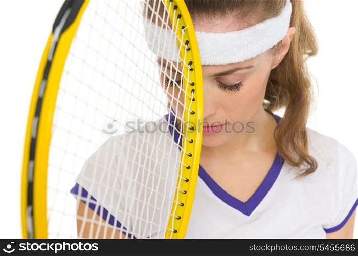 Closeup on frustrated tennis player with racket