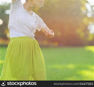 Closeup on girl dancing on meadow