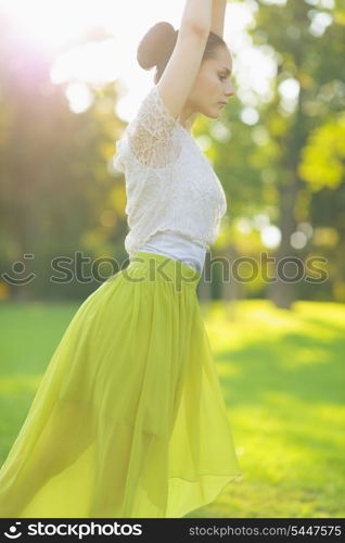 Closeup on girl dancing on meadow