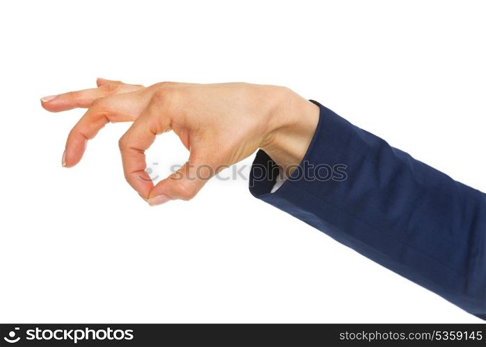 Closeup on hand of business woman holding something