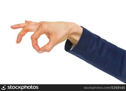 Closeup on hand of business woman holding something