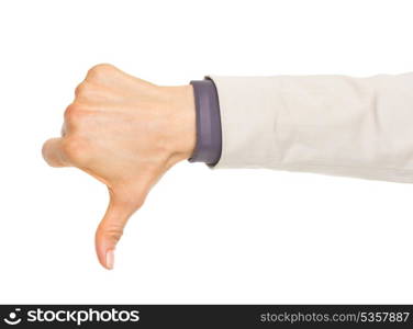 Closeup on hand of business woman showing thumbs down