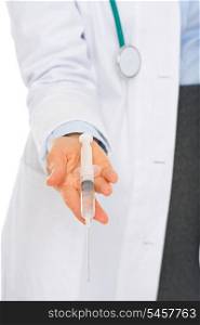 Closeup on hands of medical doctor giving syringe