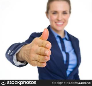 Closeup on happy business woman stretching hand for handshake
