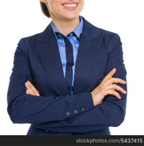 Closeup on happy business woman with crossed hands