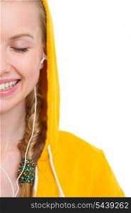 Closeup on happy teenager girl listening music in earphones