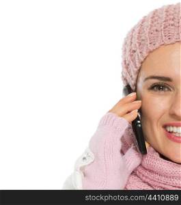 Closeup on happy woman in knit winter clothing speaking mobile