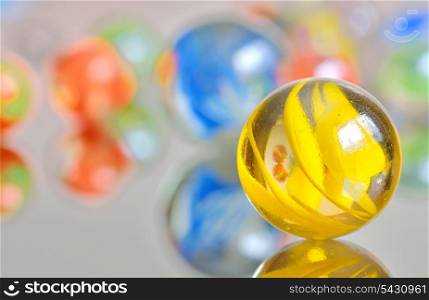 Closeup on many colorful glass marbles