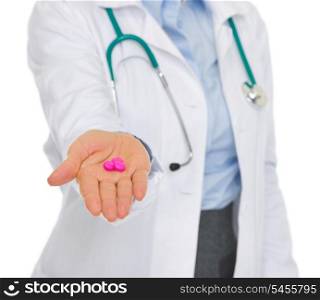 Closeup on medical doctor woman giving tablets