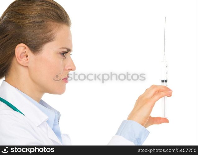 Closeup on medical doctor woman holding syringe