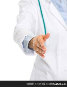 Closeup on medical doctor woman stretching hand for handshake