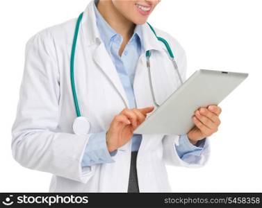 Closeup on medical doctor woman using tablet pc