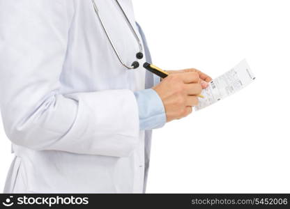 Closeup on medical doctor woman writing prescription