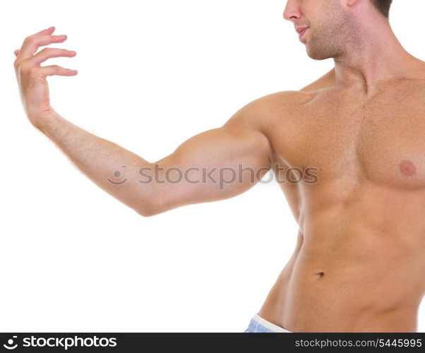 Closeup on muscular man gracefully posing