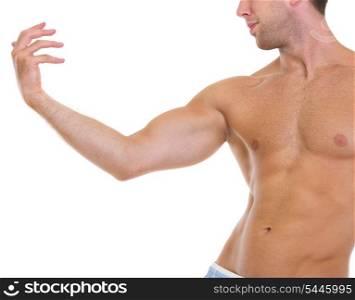Closeup on muscular man gracefully posing