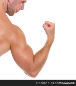 Closeup on muscular man showing biceps