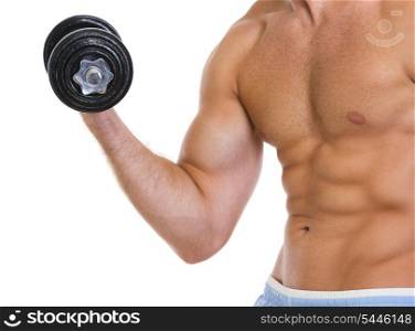 Closeup on muscular man workout biceps with dumbbell