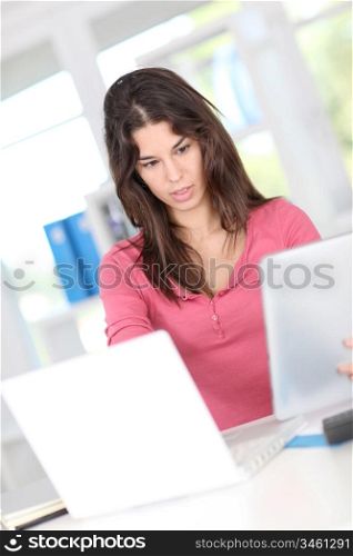 Closeup on office worker using electronic tablet