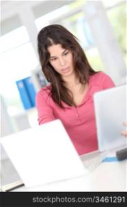 Closeup on office worker using electronic tablet
