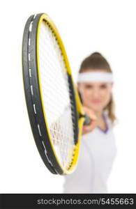 Closeup on racket holding by tennis player