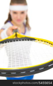 Closeup on racket in hand of tennis player