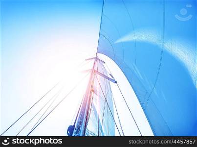 Closeup on sail on blue sky background, active lifestyle, cruise of dream, extreme water sport, summer holidays, yachting concept