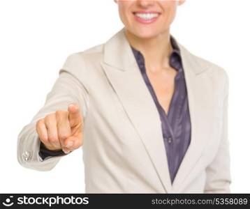 Closeup on smiling business woman pointing in camera