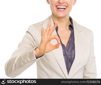 Closeup on smiling business woman showing ok gesture