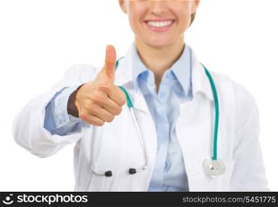 Closeup on smiling doctor woman showing thumbs up