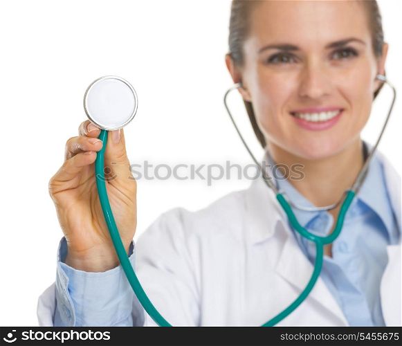 Closeup on smiling doctor woman using stethoscope