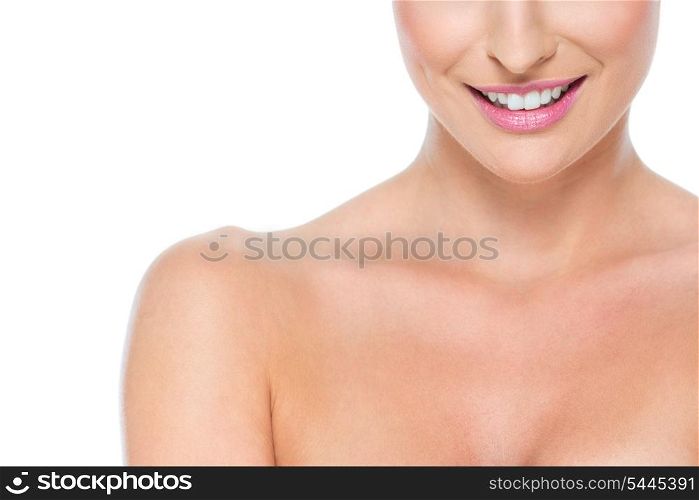 Closeup on smiling female lips isolated on white