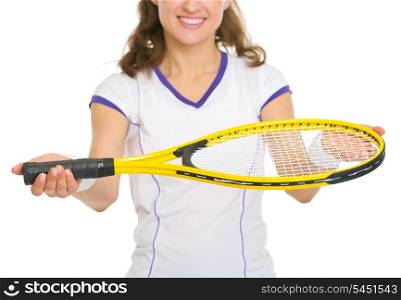 Closeup on smiling female tennis player giving racket