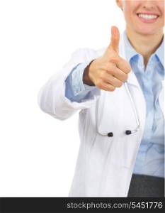 Closeup on smiling medical doctor woman showing thumbs up