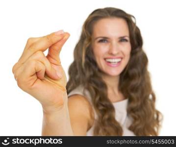 Closeup on smiling young woman snapping fingers