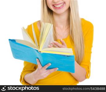 Closeup on student girl leaf through book
