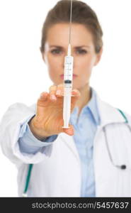 Closeup on syringe in hand of doctor woman