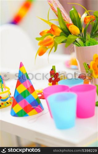 Closeup on table decorated for baby birthday celebration