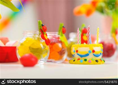 Closeup on table decorated for baby birthday party