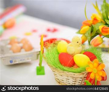 Closeup on table with Easter eggs and decoration stuff