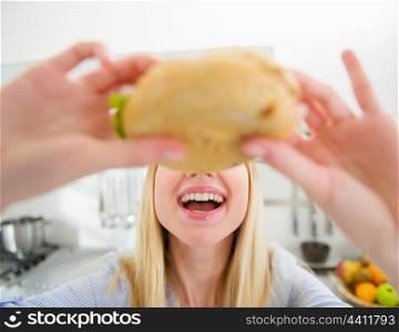 Closeup on teenager girl eating sandwich
