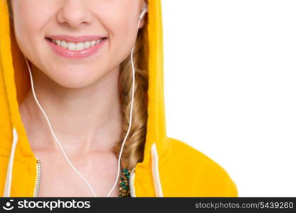 Closeup on teenager girl listening music in earphones